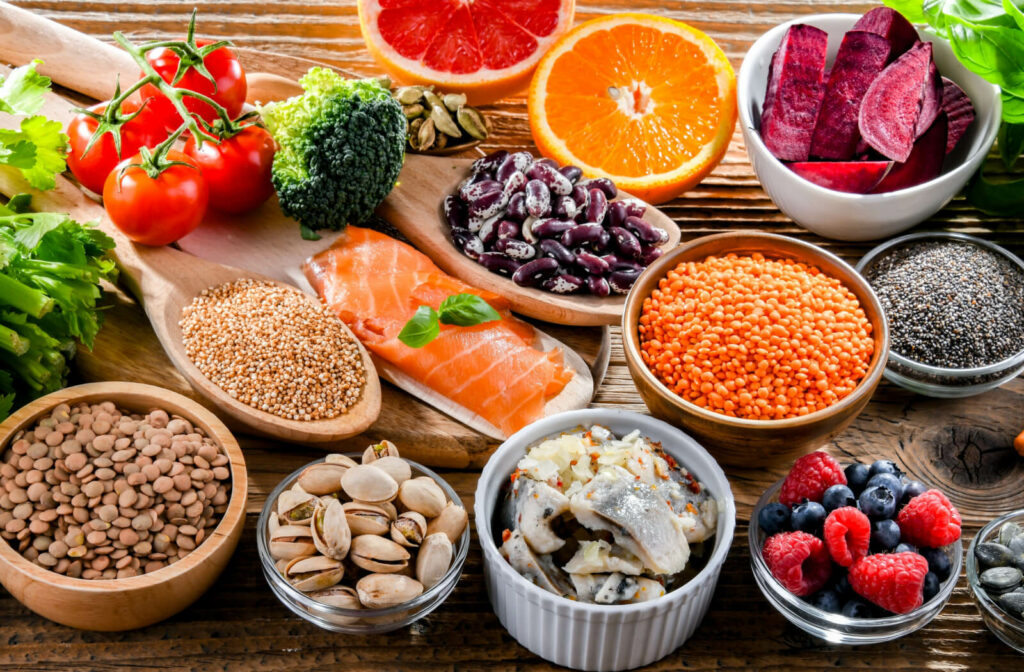 A selection of fruits, vegetables, whole grains, and salmon meat that supports the preservation and enhancement of cognitive function and memory.
