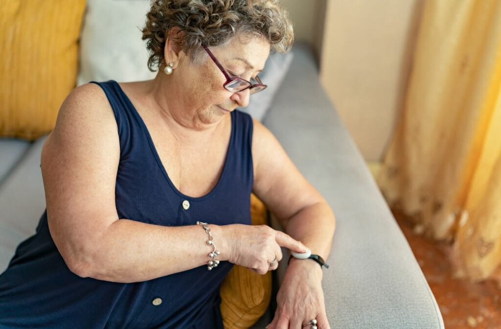 A woman testing a Life Alert wristband.